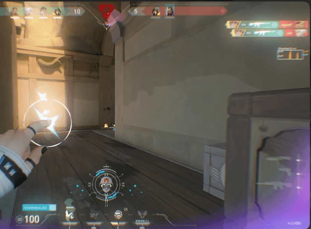 First-person Valorant gameplay with an aim highlight around the crosshair